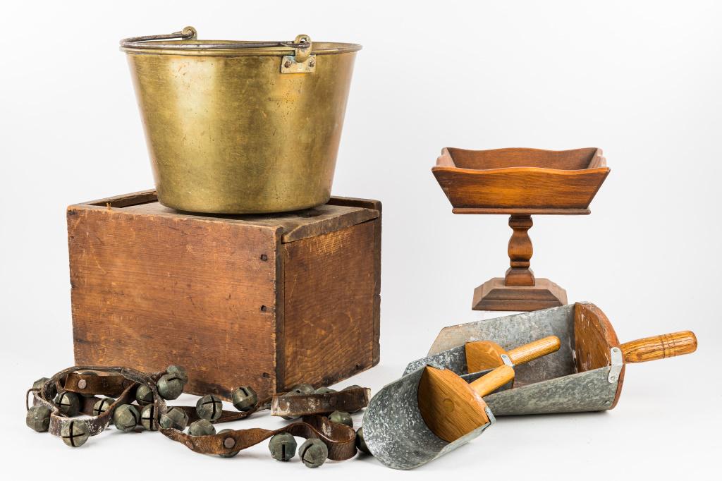 Antique Wood & Brass Items: Antique wood and brass items including 1 large candle box, 1 brass bucket marked '3' on handle attachments approx 8.5"H x 12.75" diam, 3 grain scoops, 1 wood fruit stand, and sleigh bells.