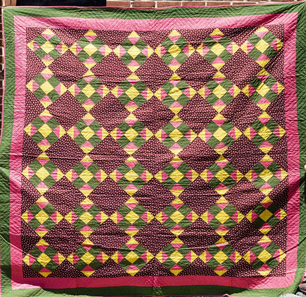 Vintage Handmade Quilt Blanket: Vintage handmade quilt blanket from York County PA Estate, in greens, yellows, pinks and reds with 9 square pattern, approx 90" x 90", wear commensurate with age and use, sold as seen in photos.