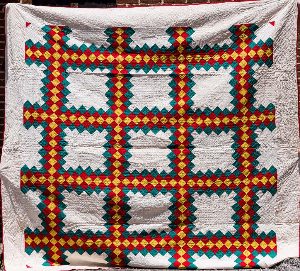 Vintage Handmade Quilt Blanket: Vintage handmade quilt blanket from York County PA Estate, in greens, yellows, reds and whites, approx 100" x 100", wear commensurate with age and use, sold as seen in photos.