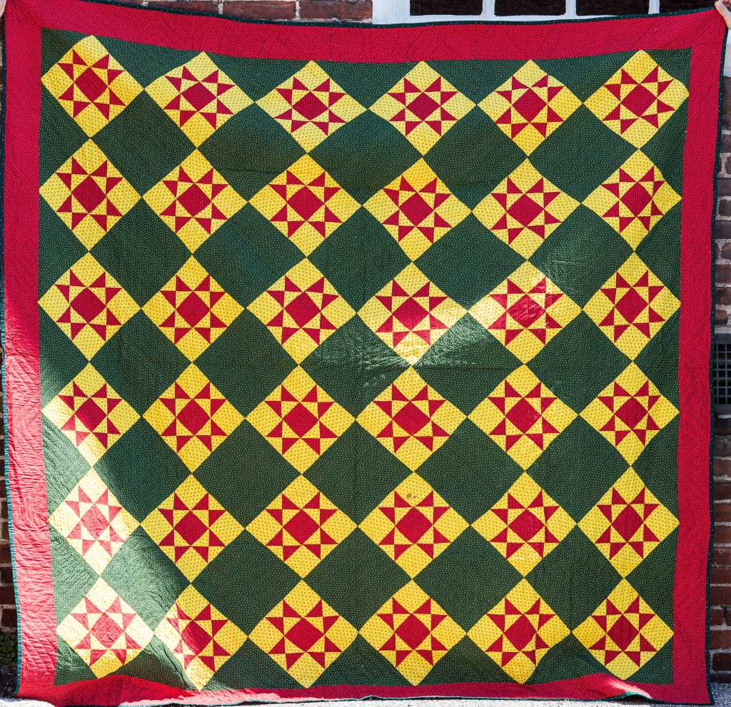 Vintage Handmade Quilt Blanket: Vintage handmade quilt blanket from York County PA Estate, in greens, yellows, and reds, approx 88" x 86", wear commensurate with age and use, sold as seen in photos.