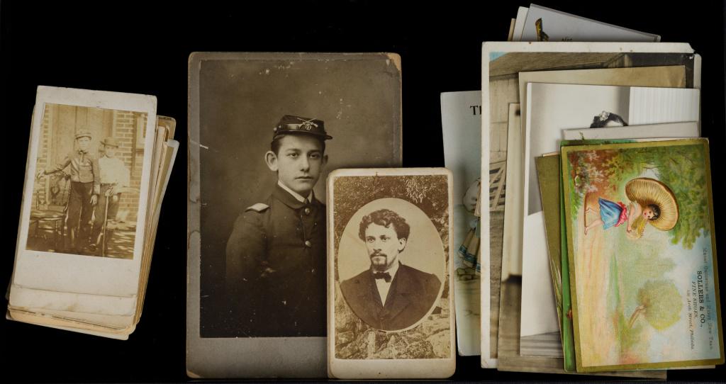 Antique Photos, Postcards & Trade Cards: Antique photos including 15 CDVs, 1 cabinet card photo with Civil War soldier in uniform, 16 trade cards, 3 real photo postcards, and photo of WWII soldier.