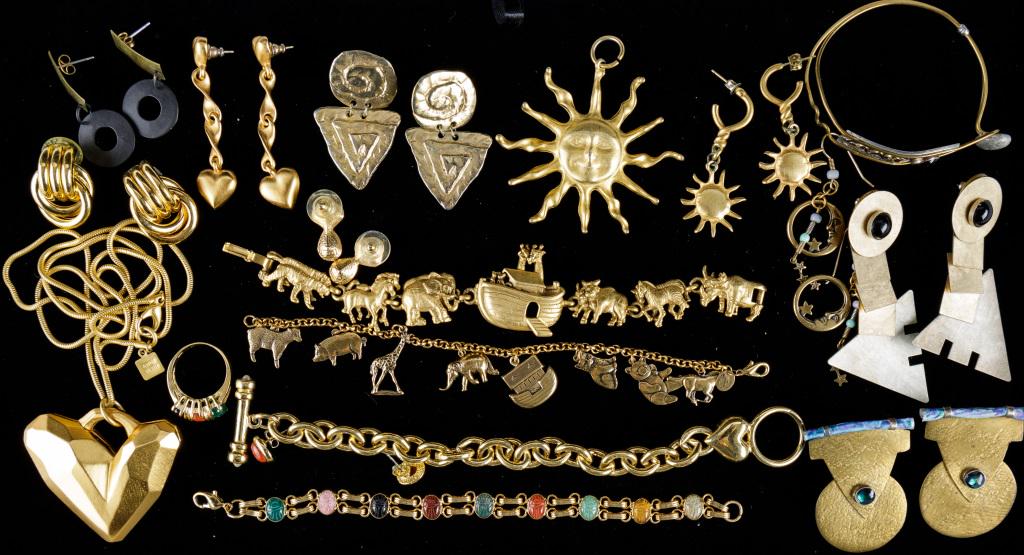 Gold Tone Costume Jewelry: Various gold tone costume jewelry including Anne Klein heart necklace, AJC and Discovery of California Noah's Ark bracelets, JJ triangle earrings, SAL blue and white stone earrings, and more.