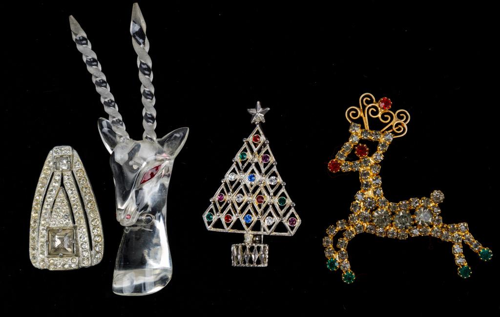 Vintage Brooches (4): Circa 1940's rare lucite gazelle clip brooch with red eyes and close attention to detail, "Eisenberg Ice" Christmas tree brooch, "Hobe" rhinestone flying reindeer brooch and pot metal rhinestone clip.