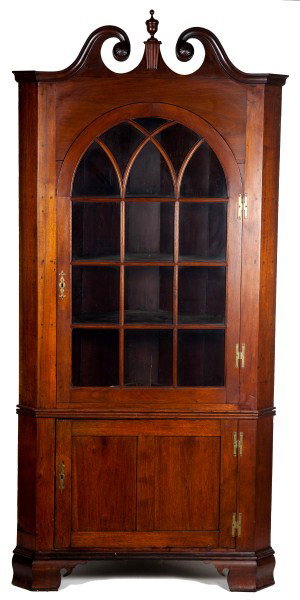 Chippendale Walnut Broken Arch Corner Cupboard: Chippendale two piece walnut corner cupboard with broken arch crest, fourteen lite arched door, paneled door and ogee bracket feet 90"h x 44"w x 27" d