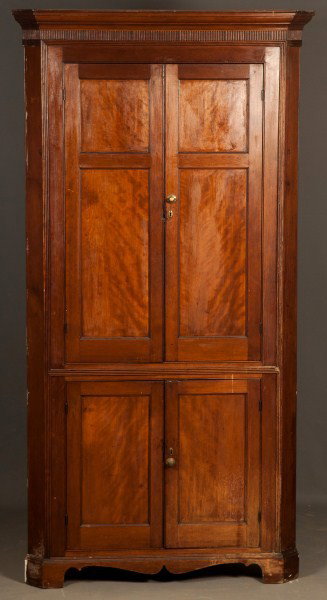 PA walnut, blind door corner cupboard 19th C: PA early 19th C walnut, blind door corner cupboard with molded cornice, raised paneled doors and molded bracket base, 90 1/2"h x 43"w and takes a 29 1/2" corner