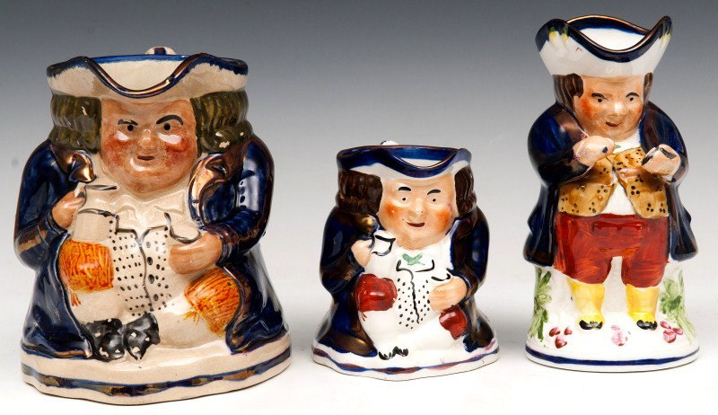 19th C Hand Painted Staffordshire Toby Jugs: Three 19th C/Early 20th C hand-painted Staffordshire Toby jugs (largest with restorations)