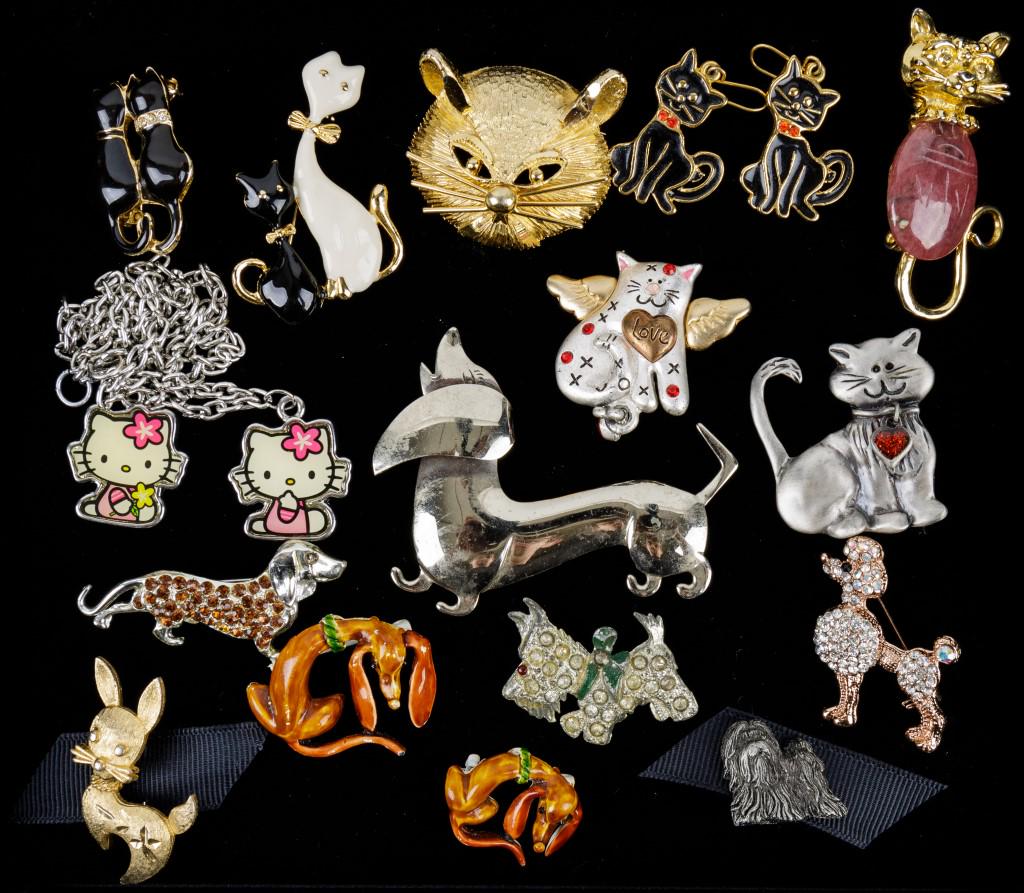 Cats & Dogs Jewelry: 16 Items of jewelry featuring a Mamselle gold tone dog pin, Hello Kitty necklace, a poodle pin with rhinestones, 4 Dachshund pins, and more.