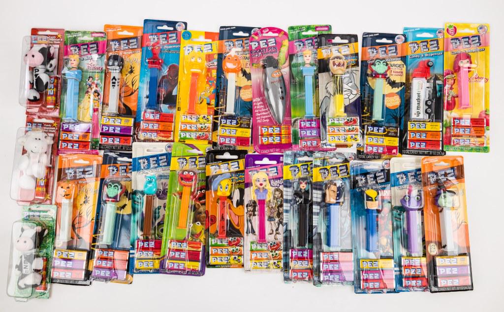 Blister Pack PEZ Dispensers (25): Approx 25 blister pack PEZ dispensers, including Disney, Looney Tunes, D.C., Marvel, Simpson's, keychain style and more.