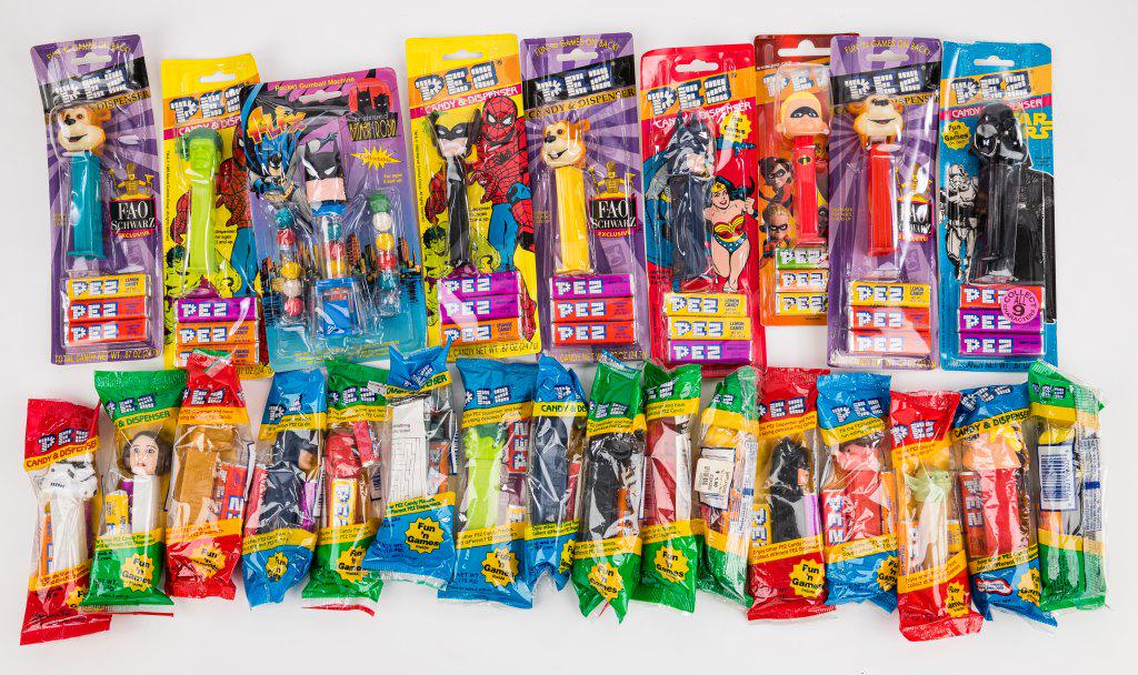 PEZ Dispensers (25): Variety of approx 25 PEZ dispensers including D.C., Marvel, Star Wars, and more, in as found condition.