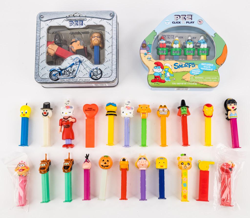 PEZ Dispensers Sets & Others: Variety of PEZ dispensers including Smurfs, Orange County Choppers, Looney Tunes, Halloween, Garfield, and more, in as found condition.