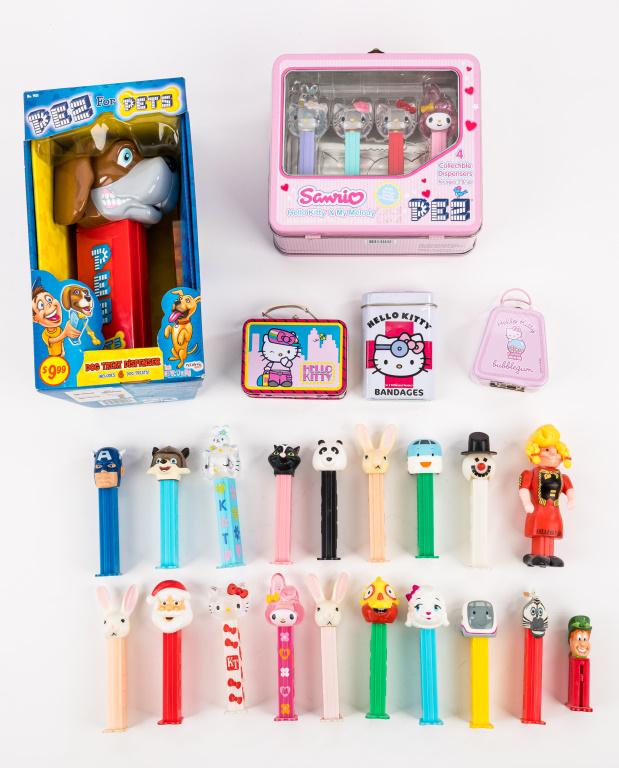 PEZ Dispensers Sets & Others: Variety of PEZ dispensers including ,Hello Kitty, PEZ for PETZ dog treat dispenser, Marvel, and more, in as found condition.