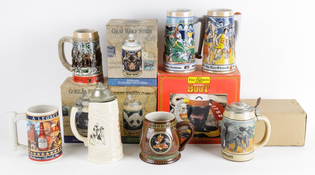 Vintage Budweiser Beer Steins: Vintage Budweiser beer steins including Budweiser endangered species steins NIB, Firefighters boot collectible stein NIB and other steins. Brand advertising.