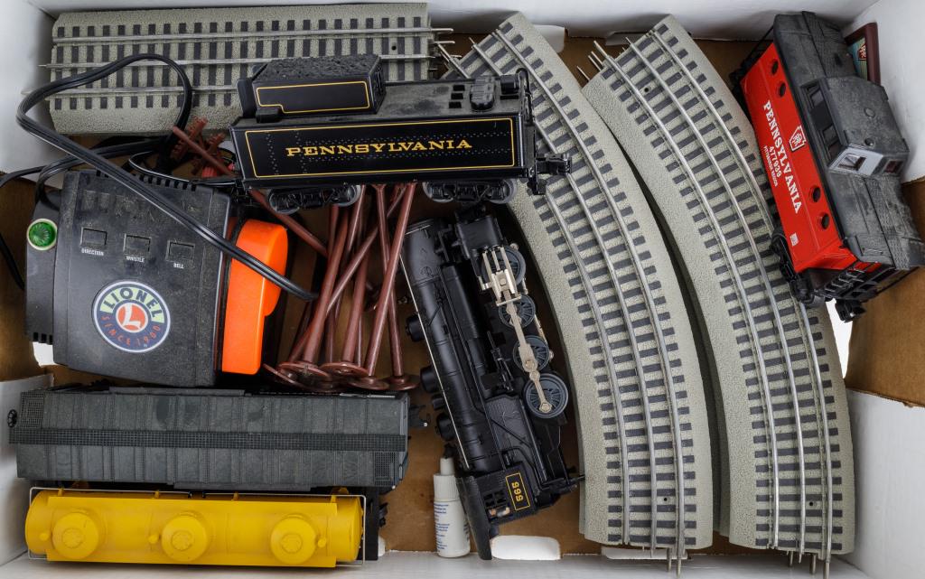 Lionel Train Set: Engine, tender, and 3 cars / Pennsylvania, Lionel transformer Powermax Plus, track, and owner's manual, and some accessories.