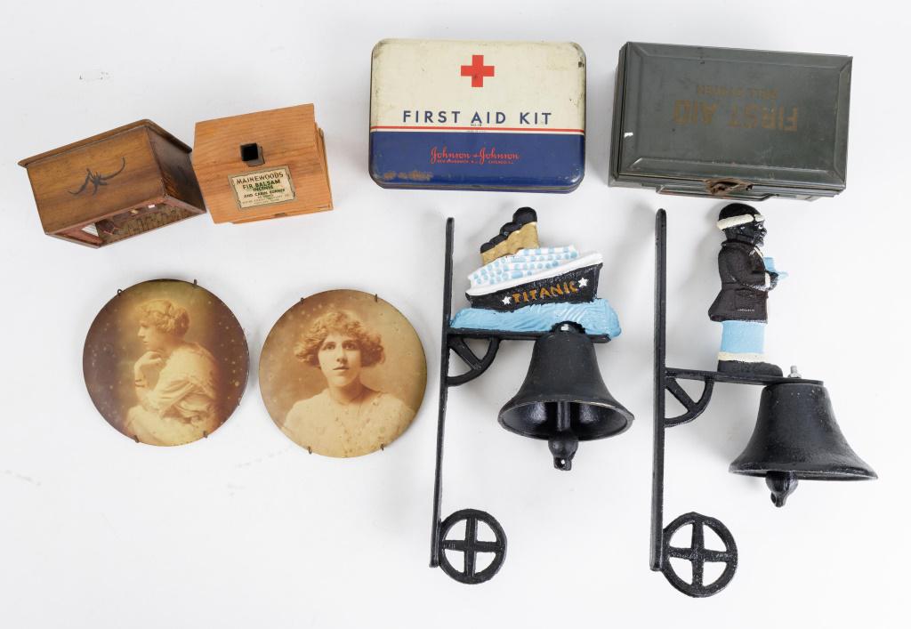 Vintage First Aid, Bells, Portraits & Souvenirs: 2 Contemporary cast iron bells of Black Americana and Titanic ship, Johnson & Johnson and Bell Telephone first aid kits including contents (Johnson & Johnson has dents on back), 2 wall hanging portrai