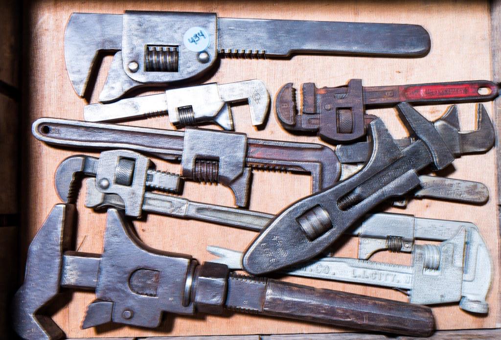 Early 20th C Monkey Wrenches (11): Includes monkey wrenches by Crusader, two A-I, one from England, two from Germany, G.M. Co. with clowbar handle, large 11 1/2" double head monkey wrench, and 3 others in a Silver Top wood crate.