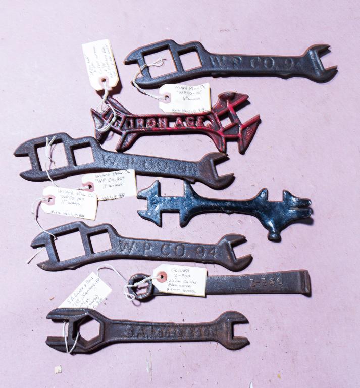 Five Early 20th C Plow Wrenches & Two Others (7): Includes plow wrenches by S.A. Loose & Sons 192 Hamburg, PA, three Wiard Plow Co. 94 11", and Oliver Z-300, plus a red painted Iron Age cutout E39 wrench and buggy style wrench with crowbar end.