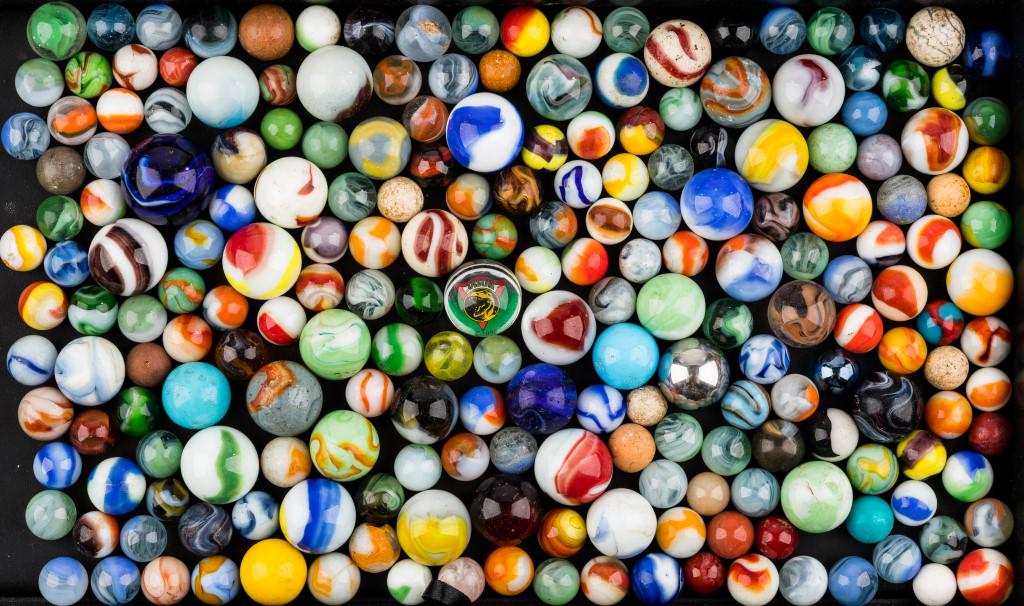 Marbles Grouping: Various ages, sizes, colors and conditions including 1994 Saban Jason character marble and a ball bearing.