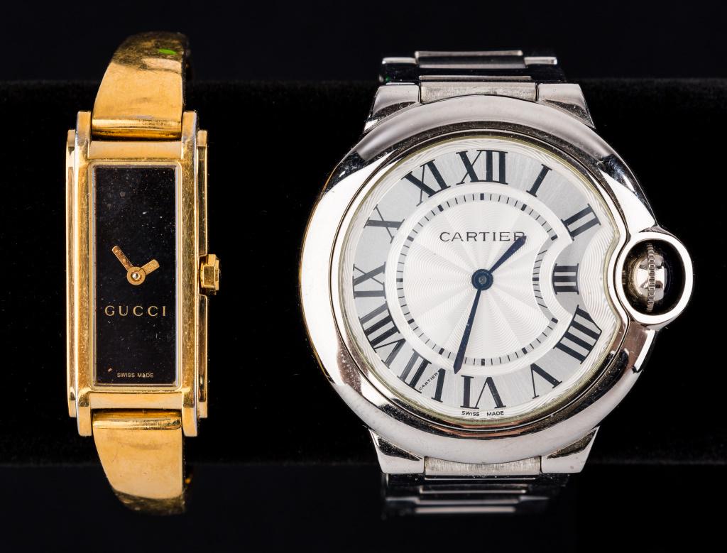 Gucci and Cartier Marked Watches: The Gucci gold tone watch is marked on face, winder, back and clasp (also says Stainless Steel) with back marked 109, Steel, copyright Gucci Swiss, 11460505. The watch marked Cartier Swiss Made on fro