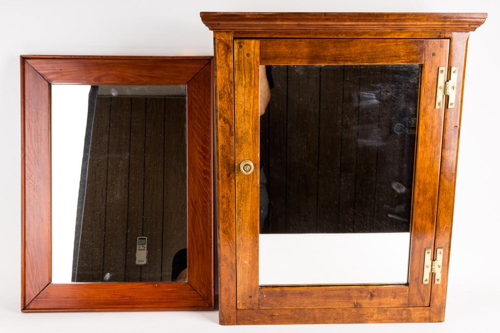Antique Mirror, Mirror Cabinet: Antique mirrored medicine cabinet with brass hinges wood peg construction door, approx 24.5"H x 20"W x 7"D, has replaced fabric backing with reproduction advertising print, and antique bathroom mirror