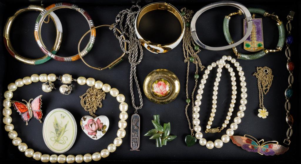 Jade, Faux Pearl & Costume Jewelry: Jade pin with bamboo motif, 2 faux pearl necklaces (1 with matching earrings), white and gold Trifari bracelet, scarab bracelet, and more.