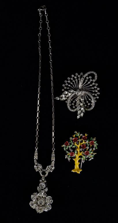 Trifari and Sterling Pennino Jewelry: Trifari items include rhinestone necklace and an enamel fur clip In the form of a tree. Enameled for clip has some loss as seen in photograph. The third item is a Sterling Pennino Brooch accented with