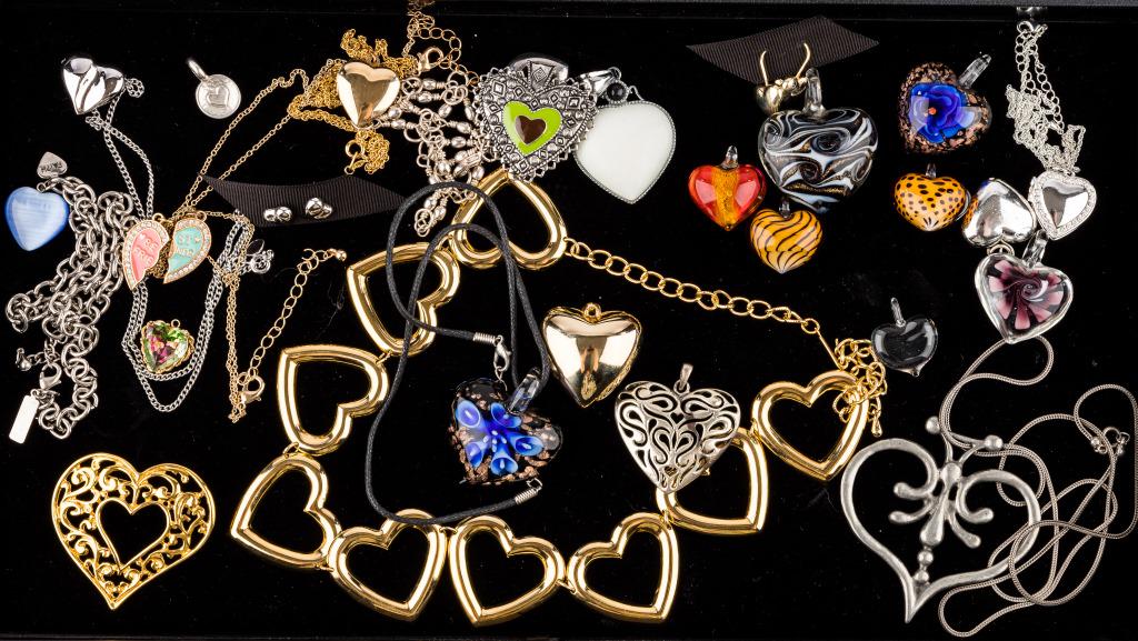 Glass, Silver Tone & Gold Tone Hearts: 26 pieces of costume heart jewelry featuring 8 blow glass heart pendants, heart necklaces, heart earrings, locket and pendants. Largest is metal heart necklace with chain measuring approx 28", heart d