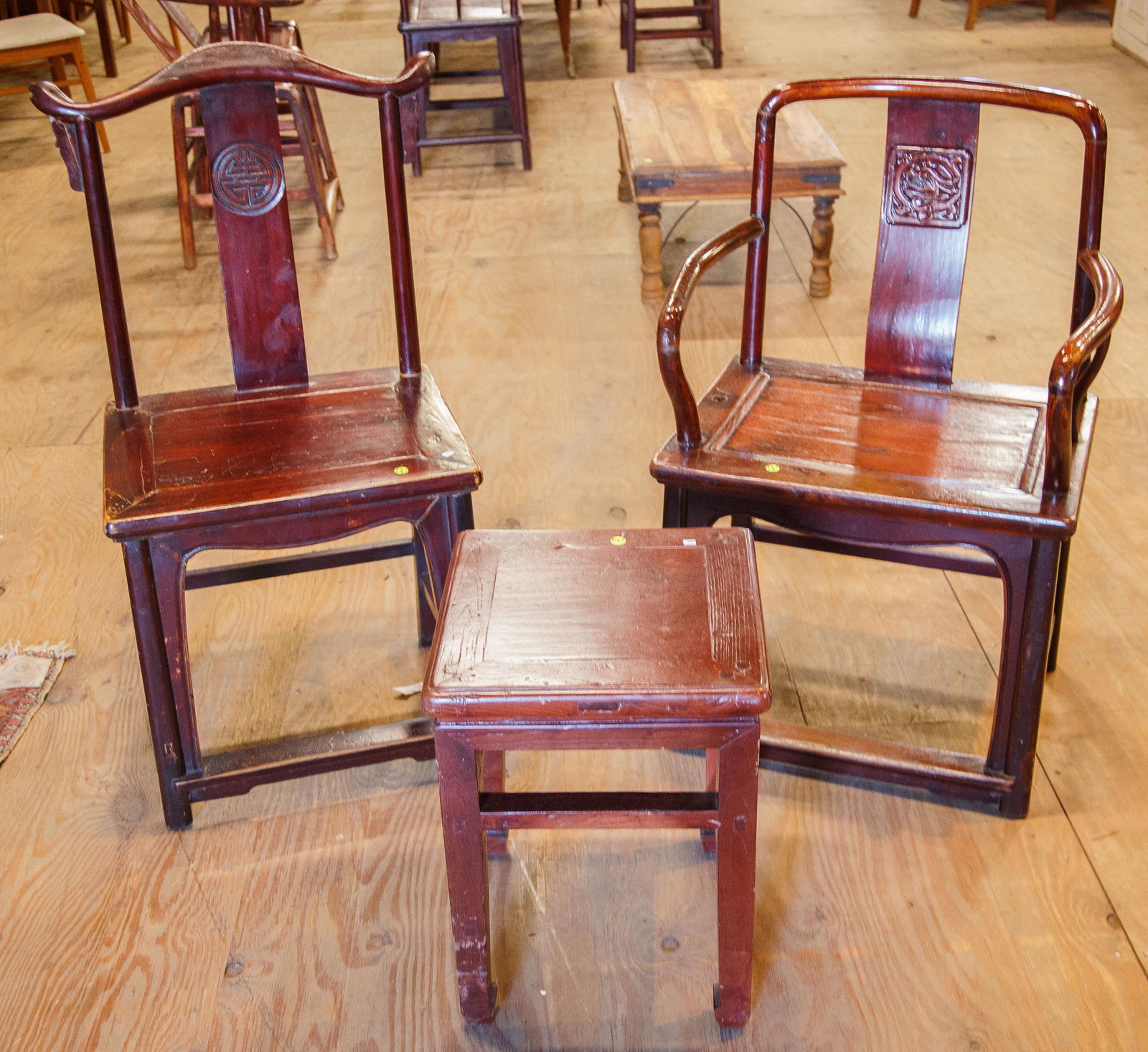 Chinese Carved Chairs (2) and Table: Carved decoration, stretcher base, remnants of paint/stain. Dragon carved into back splat of armchair, medallion of the side chair with yoke crest rail. Side chair approx 41.5" H x 20.5" W x 16.5" D,
