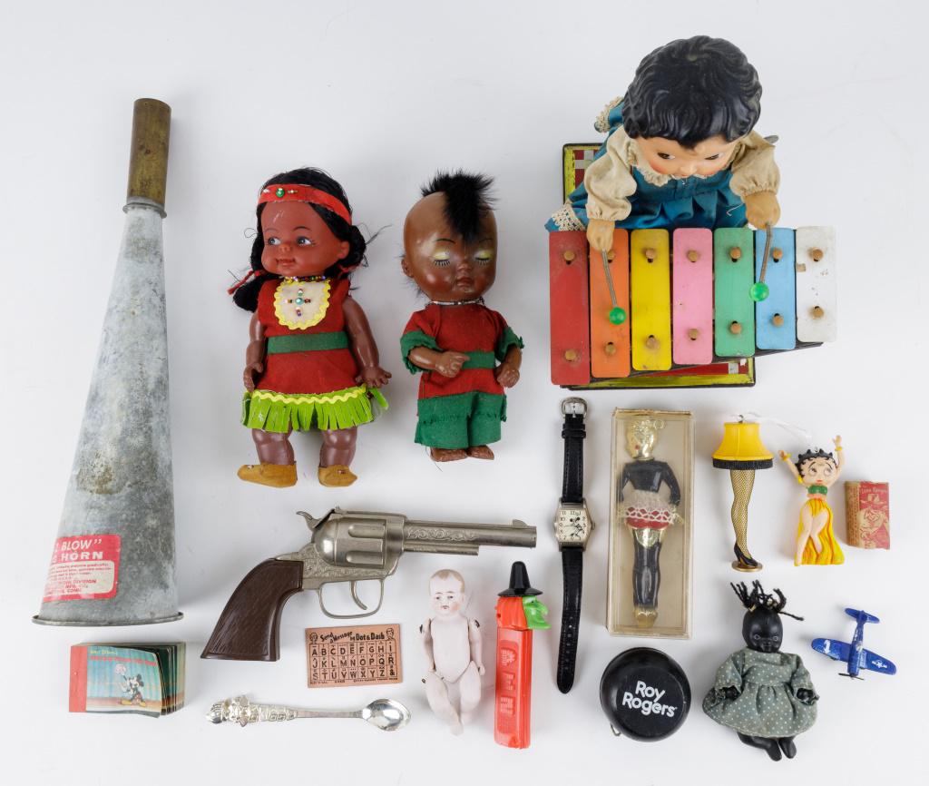 Vintage Toys, Disney, Pez & Wind Up: Vintage vinyl Native American dolls, China made tin litho windup xylophone player (works), 'E-Z Blow' fog horn, sexy maid novelty bottle opener in original box, Acme film strip roll with little box, W