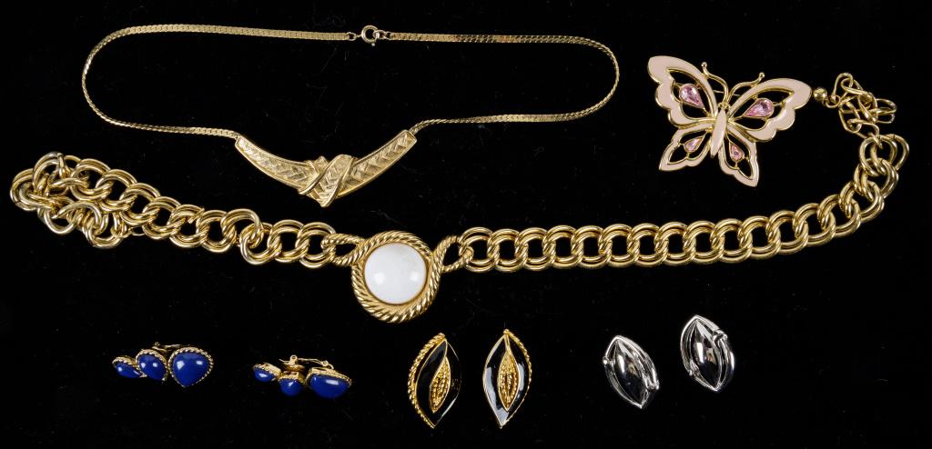 Trifari Vintage Jewelry Collection: Six signed Trifari pieces including two large gholdtone necklaces, three pairs of clip on earrings, and a pink crystal butterfly brooch.