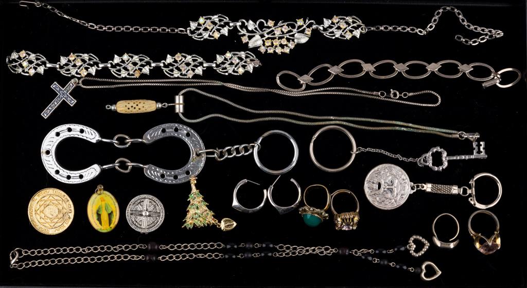 Costume and Collectible Estate Jewelry: 18 pieces including matching necklace and bracelet, three necklaces, one pair of earrings, four cocktail rings, Christmas tree pin, earrings, religious pendant and medals, and three keychains.