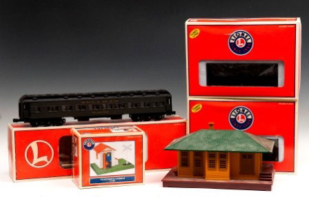 Lionel Train Lot: One #6-19057 Pullman Passenger car, one #145 Automatic Gateman #6-14091; two #6-26849 Southern Pacific Log Dump car, boxes only and one lionelville plastic station house