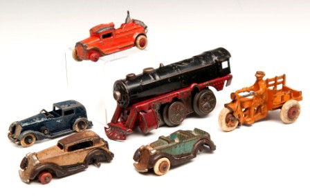Vintage Lot Toy Cars and a Wind-up Train: Grouping of vintage toys including a working wind-up toy train attributed to Marx (missing a wheel), two Hubley coups and a tow truck (all missing at least one wheel), a Tootsie Toy Ford and a Hubley