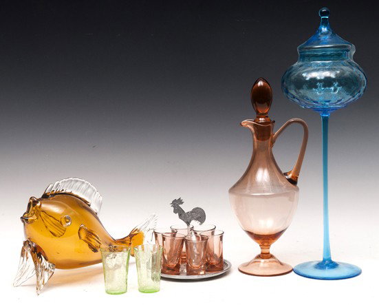 Glass Decanter, Art Glass Fish: Pink depression glass decanter with metal tray and six shot glasses; one art glass Blenko amber fish; one blue tall stemmed compote and two green crackle glass shot glasses, both with flakes