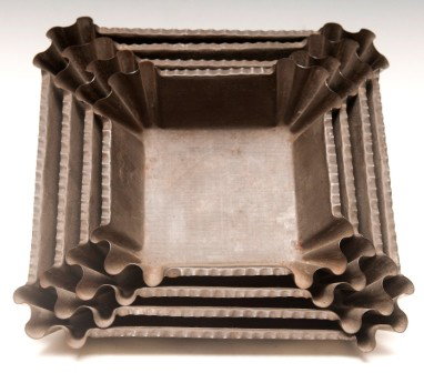 Set of Four Tin Graduated Cake Molds 19th C: Set of four Tin graduated cake molds with ruffled corners 19th C
