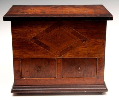 Folk Art Storage Box: Folk Art storage box with inlaid top depicting a cabin and diamond inlay design on front over two drawers and peg feet