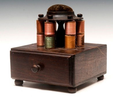 Mahogany Sewing Box & Pin Cushion: Mahogany sewing box with a velvet pin cushion on turned pedestal over a single drawer and knob feet; 8"h x 7"w x 7"d
