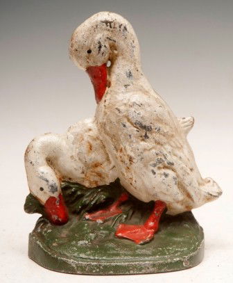 Cast Iron Duck Stop: Cast iron doorstop of two ducks, stamped CN on the back, 8.65"h