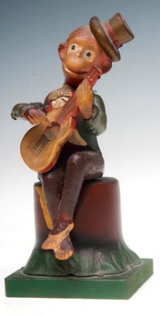 Wind up Monkey Toy: Wind up celluloid monkey playing guitar sitting on tin stump 8", very good condition and in working order
