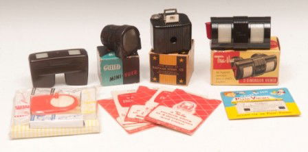 Baby Brownie Camera, Viewers: Kodak Baby Brownie camera with original box; two Tru-Vue viewers with four packs of color slides; one Guild Mini-Vuer; one Pixie Views pictures and one toy plastic movie projector with film in origina