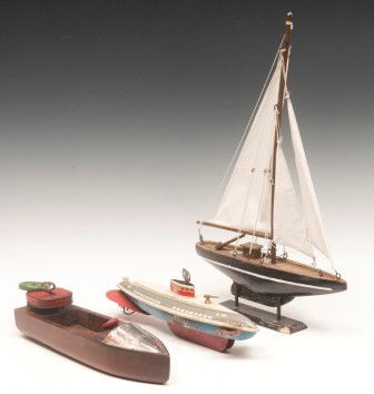 Wolverine Wind Up Boat and Toy Boats: One Wolverine wind up toy Boat , paint condition as is, 12-3/4"l; one wooden wind up toy boat, 13-1/2"l and one toy wooden sail boat, linen sails, 12-1/2"l