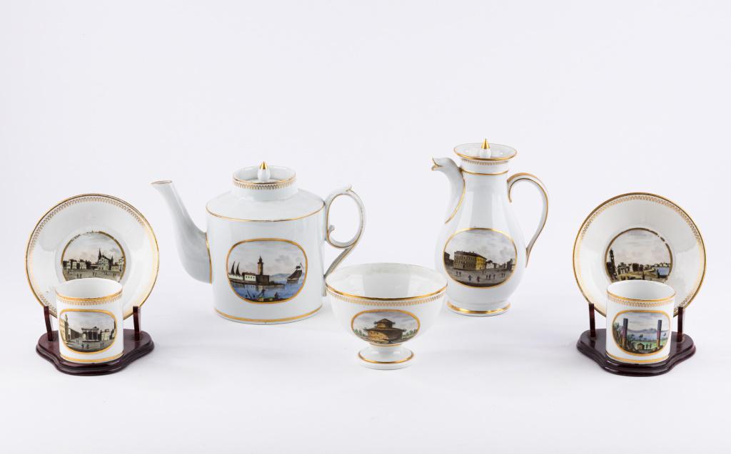 Early 19th C Italian Porcelain Tea Service: Tea pot, coffee pot, two cups and saucers, sugar or waste bowl. Each with hand painted Italian townscapes (Pisa, Pompei, Piazza del Granduce in Florence). Some with hand painted gold star mark on bott