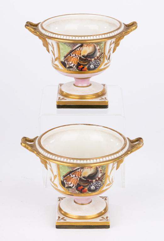 Mottahedeh Italian Urns with Bases (2): Both approx 5 1/2" D x 4" H with goat handles and shell decoration. Marked Italy on base.