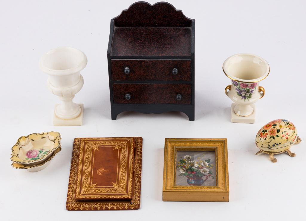 Decorative Desk Items: Small alabaster urn (approx 5" H), unmarked urn (approx 4 1/4" H), wooden egg made in India, two dishes (approx 4" W), leather notepad, silk miniature painting approx 4" x 5", and miniature antique-st