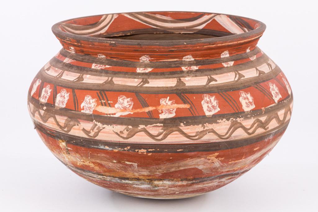 Large Southwest Style Pot: Large southwest style pottery pot with red, cream, and brown design, rounded bottom, measures approx 13.5" at rim, 12"D, 20"W at the belly.