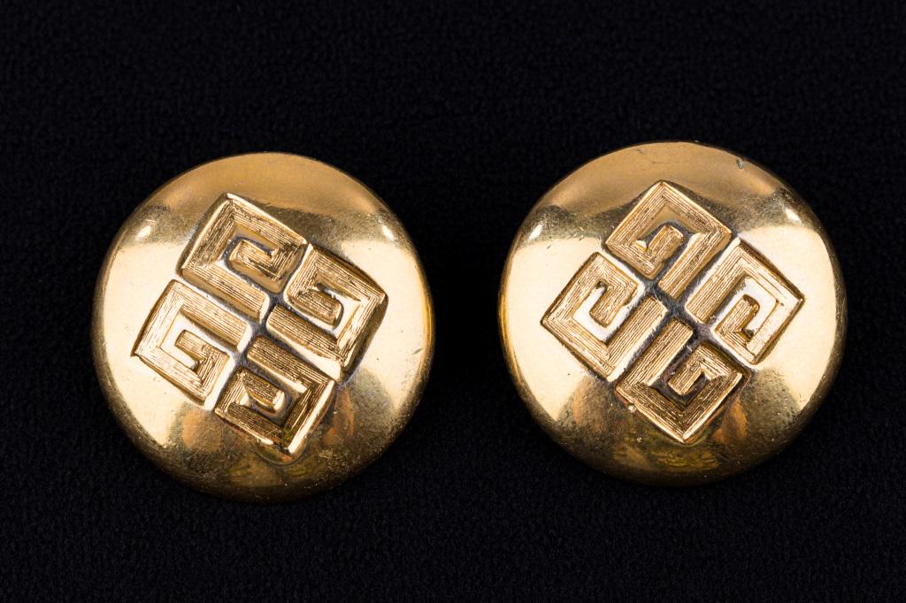 Givenchy Designer Earrings: "Givenchy" signed large gold tone round logo earrings signed "Givenchy".