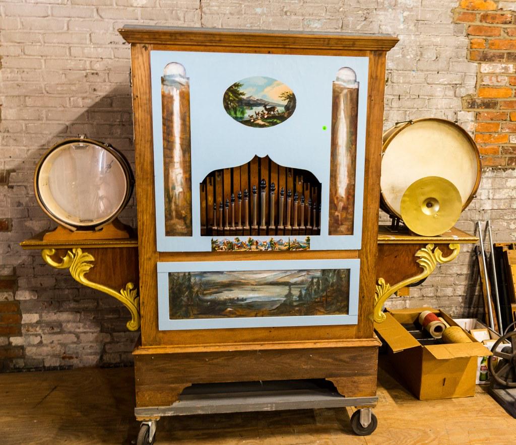 European Band Organ: Unusual European band organ with a bass drum, snare drum, cymbal, featuring over 100 pipes, plays 150 rolls, includes 21 rolls. Brass dragon accents. Original bellows included and in need of restorati