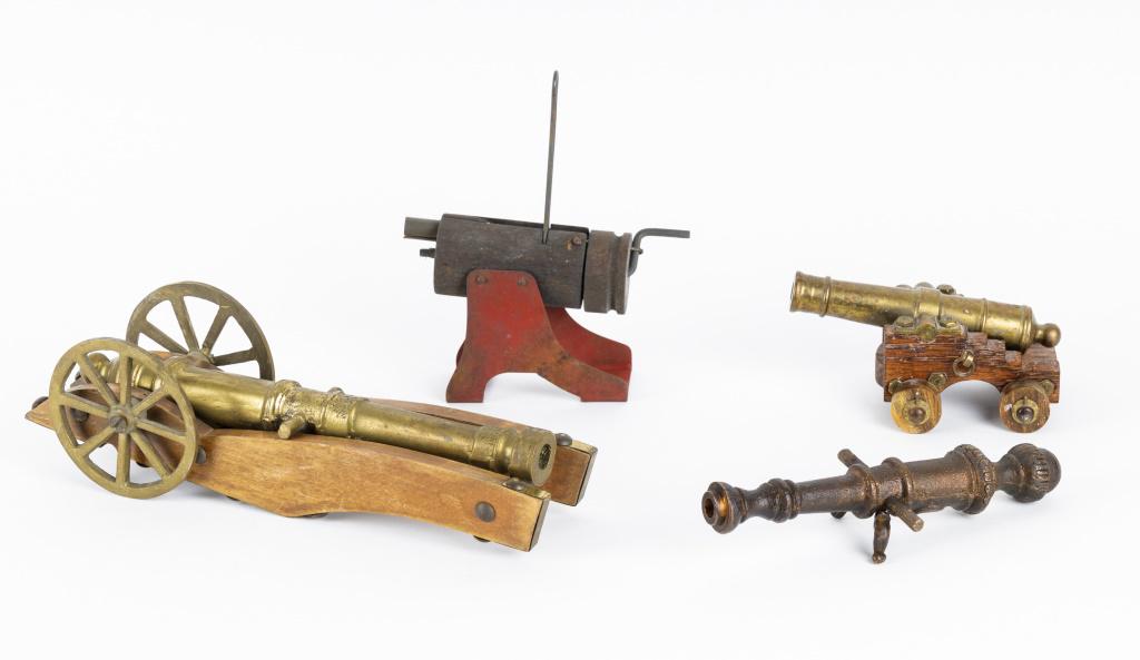 Antique & Vintage Toy Signal Cannons: 4 cannons. 2 are antique and 2 vintage. One antique bronze toy signal cannon measures approx 7" L and a 1920's wood and tin cannon approx 5 1/2" L. Additionally there are 2 brass vintage brass cannons