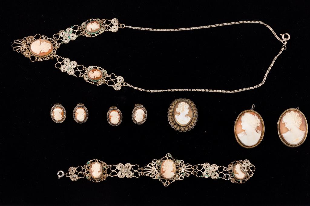 Victorian Silver Jewelry: Seven pieces of cameo .800 silver jewelry including a necklace measuring approx 18" L. Also includes a bracelet measuring approx 7" L, two pairs of clip earrings and three brooches. All in good condit