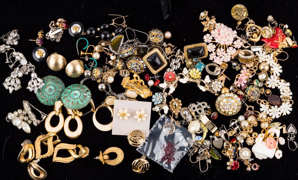 Costume Earrings (25 pairs): Includes 25 matched pairs of earrings including some by Trifari, Napier and Monet. There are 100+ pieces of unsearched odd jewelry pieces (without pairs). Some of the sets have missing stones. Please