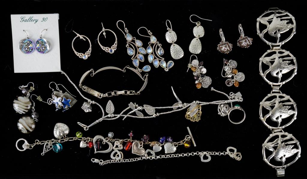 Sterling & Silver Tone Jewelry: This lot includes both sterling and silver tone jewelry. Items marked sterling include round Celtic style earrings, heart bracelet, bracelet monogrammed Irmgard.